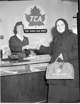 Old German woman at the Trans-Canada Airline (TCA) counter