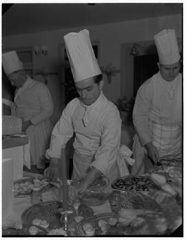 Chef Andre Fernon working on a seafood dinner