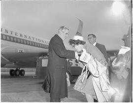 Woman kissing Bishop Fulton Sheen's ring