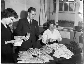 Mail order staff working on large mail from US