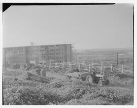 Flats on the industrial area with airport in background