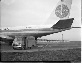 Pan American Airlines (PAA) Boeing 707 jet with restaurant van on tarmac