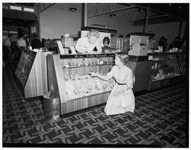 Passengers arriving at new shop in Shannon, featuring Miss K.A. Bittwer at the Perfume counter