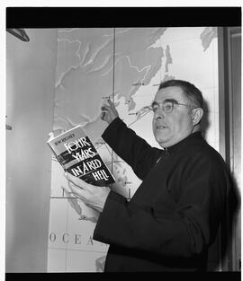 Reverend Father R. Rigney giving a lecture at the Airport Club