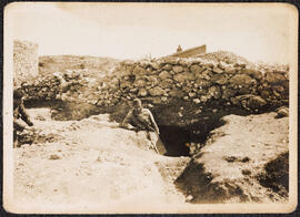 Photograph of [James Roche] outside a bunker