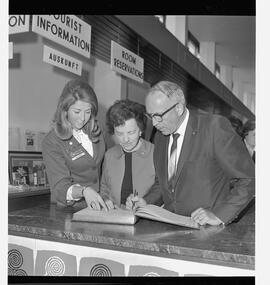 Dr and Mrs Brooks Calif at tourist desk