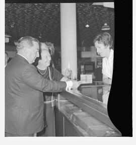 Mr and Mrs J. E. Powers from Massachusetts, USA at tourist desk