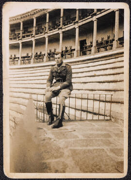 Photograph of James Roche seated at a bullring in Cáceres